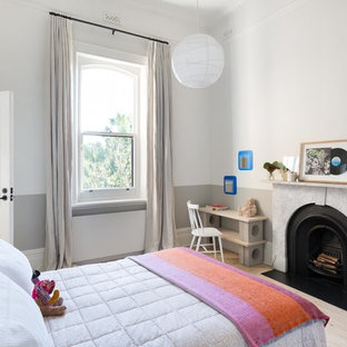 Photo of a transitional kids' bedroom in Melbourne with grey walls, light hardwood floors and beige floor.