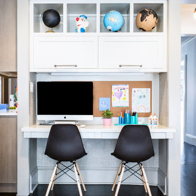 Inspiration for a small transitional gender-neutral dark wood floor kids' room remodel in New York with gray walls