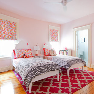 Transitional girl light wood floor kids' bedroom photo in Richmond with pink walls