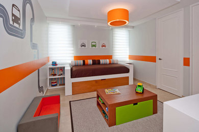 This is an example of a medium sized contemporary toddler’s room for boys in Other with marble flooring.