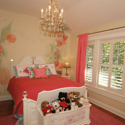 Example of a classic girl medium tone wood floor kids' room design in Tampa with yellow walls