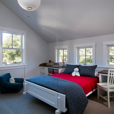 Elegant gender-neutral carpeted kids' room photo in San Francisco with gray walls