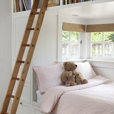 Transitional gender-neutral dark wood floor kids' room photo in San Francisco with white walls