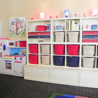 Example of a large transitional gender-neutral carpeted kids' room design in Los Angeles with yellow walls