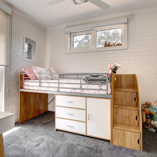 Mid-sized contemporary kids' bedroom in Adelaide with white walls, carpet and grey floor for kids 4-10 years old and girls.