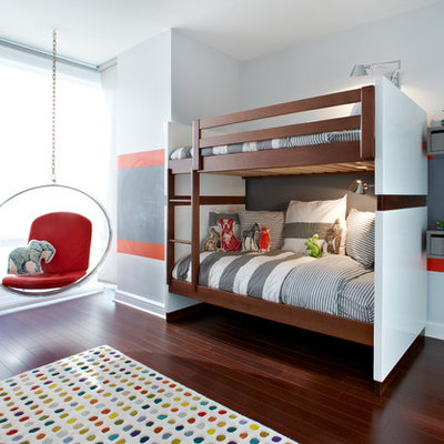 Example of a mid-sized trendy boy dark wood floor kids' room design in New York with multicolored walls