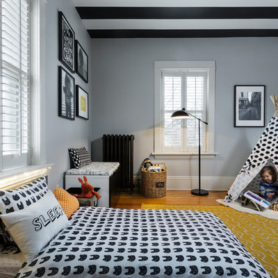 Small trendy boy light wood floor kids' room photo in Chicago with gray walls
