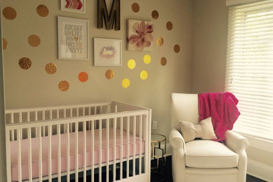 Inspiration for a mid-sized modern girl dark wood floor nursery remodel in Orlando with gray walls