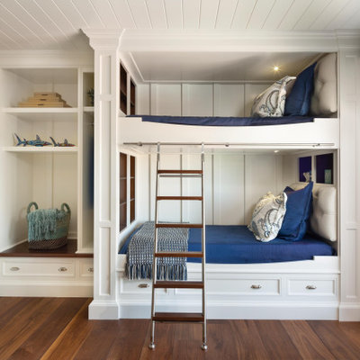Inspiration for a mid-sized coastal gender-neutral medium tone wood floor, brown floor and shiplap ceiling kids' room remodel in Miami with white walls