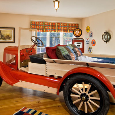 Inspiration for an eclectic boy medium tone wood floor kids' room remodel in New York with beige walls