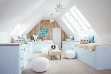 Design ideas for a nautical children’s room for girls in Portland Maine with carpet and beige floors.