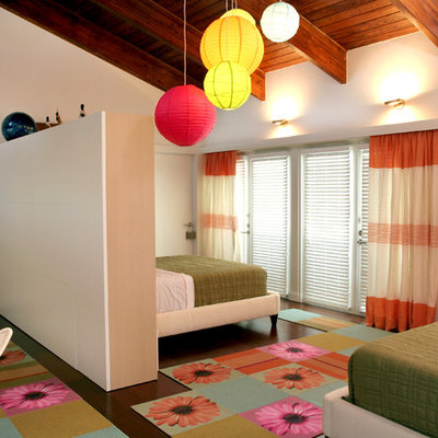 Example of a mid-sized trendy girl dark wood floor and brown floor kids' room design in Miami with white walls