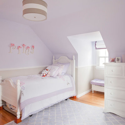 Kids' room - traditional girl medium tone wood floor kids' room idea in Los Angeles with purple walls