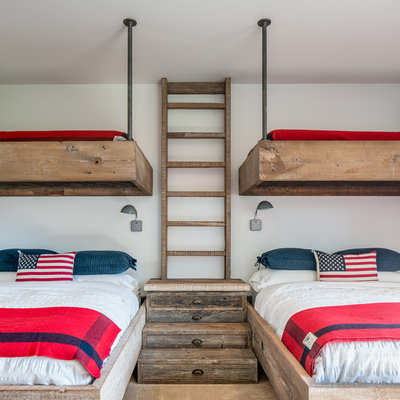 Example of a mountain style gender-neutral kids' room design in Other with white walls