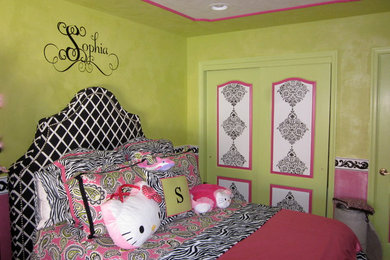 Inspiration for a mid-sized transitional girl carpeted kids' room remodel in New York with green walls