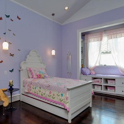Example of a classic girl kids' bedroom design in Houston with purple walls