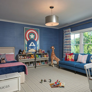 Example of a classic boy carpeted and gray floor kids' room design in New York with blue walls