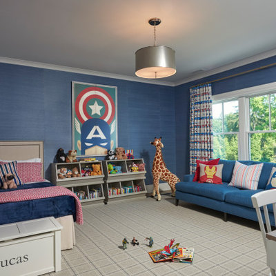 Example of a classic boy carpeted and gray floor kids' room design in New York with blue walls