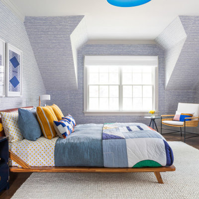 Example of a large trendy boy brown floor and medium tone wood floor kids' room design in New York with blue walls