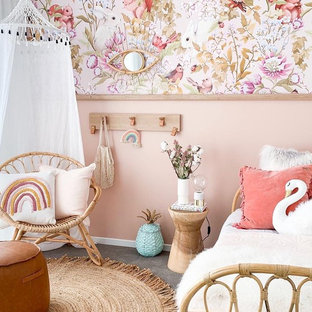 Design ideas for a beach style kids' bedroom for kids 4-10 years old in Melbourne with pink walls, carpet and grey floor.