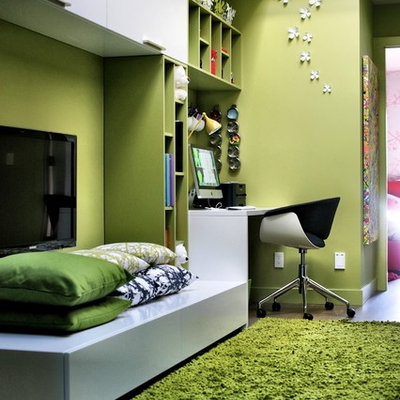 Example of a trendy gender-neutral dark wood floor kids' room design in Vancouver with green walls