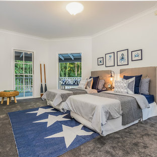 Design ideas for a mid-sized beach style kids' room for boys in Brisbane with white walls, carpet and grey floor.