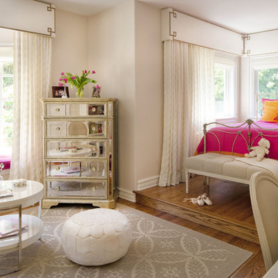 Kids' room - mid-sized eclectic girl medium tone wood floor kids' room idea in Los Angeles with pink walls
