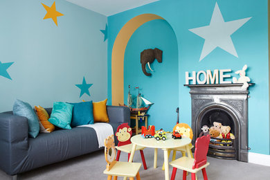 Photo of a traditional gender neutral kids' bedroom in Other with blue walls, carpet and a chimney breast.