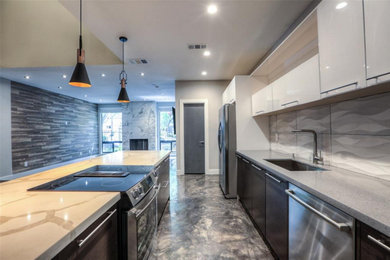 Kitchen - mid-sized contemporary galley concrete floor and gray floor kitchen idea in Houston with an undermount sink, flat-panel cabinets, dark wood cabinets, quartz countertops, gray backsplash, porcelain backsplash, stainless steel appliances, a peninsula and white countertops