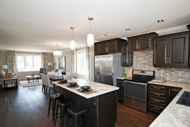 Mid-sized transitional l-shaped dark wood floor eat-in kitchen photo in Other with a drop-in sink, raised-panel cabinets, dark wood cabinets, laminate countertops, multicolored backsplash, metal backsplash, stainless steel appliances and an island