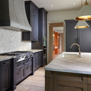 This is an example of a mid-sized u-shaped kitchen in Miami with a drop-in sink, louvered cabinets, purple cabinets, marble benchtops, grey splashback, marble splashback, stainless steel appliances, light hardwood floors, with island and multi-coloured floor.