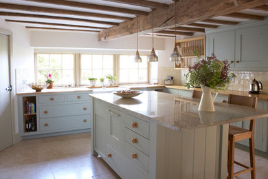 Photo of a traditional kitchen in Devon with an island.