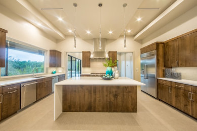 Example of a large trendy u-shaped ceramic tile eat-in kitchen design in Austin with a single-bowl sink, flat-panel cabinets, medium tone wood cabinets, quartzite countertops, beige backsplash, glass tile backsplash, stainless steel appliances and an island