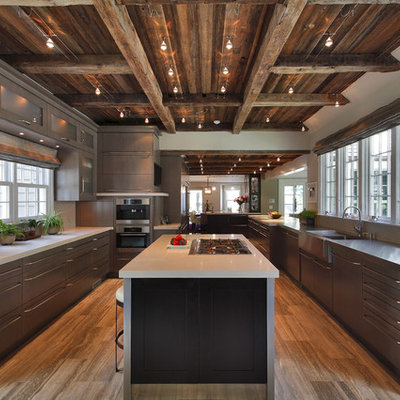 Large mountain style u-shaped travertine floor enclosed kitchen photo in New York with stainless steel appliances, flat-panel cabinets, an integrated sink, medium tone wood cabinets, concrete countertops, gray backsplash, ceramic backsplash and an island