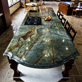 This is an example of a large traditional open plan kitchen in Denver with an undermount sink, granite benchtops, limestone floors, with island and turquoise benchtop.