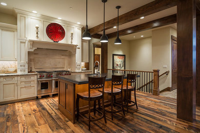 Eat-in kitchen - mid-sized country l-shaped eat-in kitchen idea in Salt Lake City with flat-panel cabinets, white cabinets, granite countertops and an island
