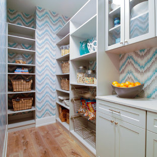 Mid-sized beach style l-shaped kitchen pantry in Minneapolis with shaker cabinets, grey cabinets, laminate benchtops, light hardwood floors and no island.