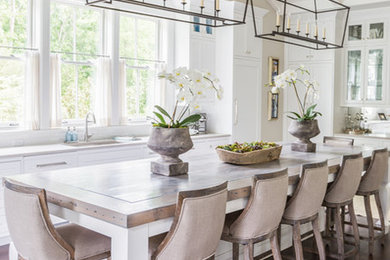 Inspiration for a large contemporary u-shaped dark wood floor eat-in kitchen remodel in Nashville with white cabinets, an island, shaker cabinets, an undermount sink, quartz countertops, white backsplash, subway tile backsplash and stainless steel appliances
