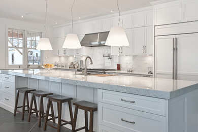 Large single-wall eat-in kitchen photo in Burlington with marble countertops and stone slab backsplash