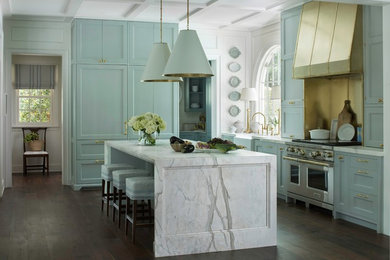 Kitchen - large traditional l-shaped dark wood floor and brown floor kitchen idea in Atlanta with marble countertops, an island, a farmhouse sink, recessed-panel cabinets, blue cabinets and paneled appliances