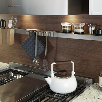 Inspiration for a large modern l-shaped concrete floor eat-in kitchen remodel in New York with a farmhouse sink, shaker cabinets, white cabinets, laminate countertops, brown backsplash, stainless steel appliances and a peninsula