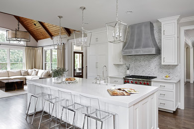 Open concept kitchen - coastal dark wood floor and brown floor open concept kitchen idea in Charleston with a farmhouse sink, shaker cabinets, white cabinets, multicolored backsplash, stainless steel appliances, an island and white countertops