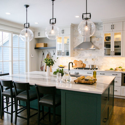 Large transitional single-wall medium tone wood floor and brown floor eat-in kitchen photo in Denver with an undermount sink, shaker cabinets, white cabinets, quartz countertops, multicolored backsplash, marble backsplash, stainless steel appliances, an island and white countertops