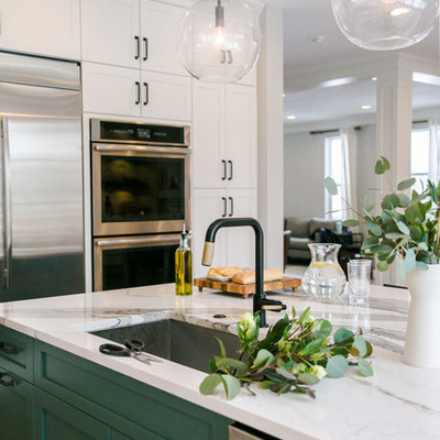 Large transitional l-shaped medium tone wood floor and brown floor eat-in kitchen photo in Denver with an undermount sink, shaker cabinets, white cabinets, quartz countertops, multicolored backsplash, marble backsplash, stainless steel appliances, an island and white countertops