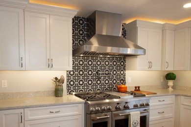 French country open concept kitchen photo in Other with recessed-panel cabinets and stainless steel appliances