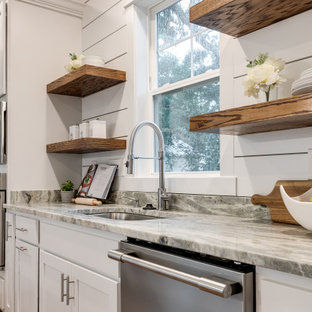 Large arts and crafts galley eat-in kitchen in Richmond with an undermount sink, recessed-panel cabinets, white cabinets, granite benchtops, white splashback, shiplap splashback, stainless steel appliances, medium hardwood floors, with island, brown floor and grey benchtop.