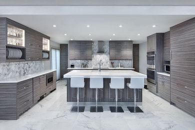 Example of a mid-sized minimalist u-shaped marble floor and white floor open concept kitchen design in Miami with a double-bowl sink, flat-panel cabinets, gray cabinets, quartz countertops, white backsplash, porcelain backsplash, stainless steel appliances, an island and white countertops