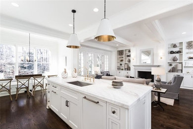 Large country l-shaped dark wood floor open concept kitchen photo in Atlanta with an undermount sink, recessed-panel cabinets, white cabinets, marble countertops, white backsplash, ceramic backsplash, paneled appliances and an island