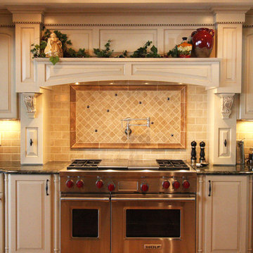 48” Wolf gas range with hood mantle and back-splash with pot-filler faucet