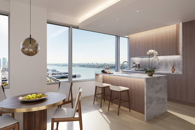 Eat-in kitchen - mid-sized modern galley eat-in kitchen idea in New York with flat-panel cabinets, an island and gray countertops